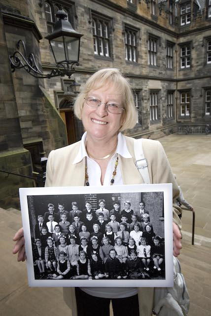 LBC female participant with school photo at reunion